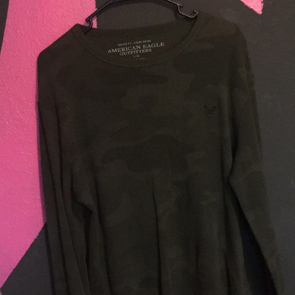 Men’s green long sleeve shirt.